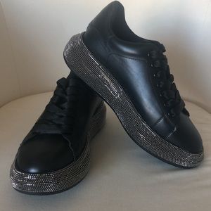 Brand new black sneakers.